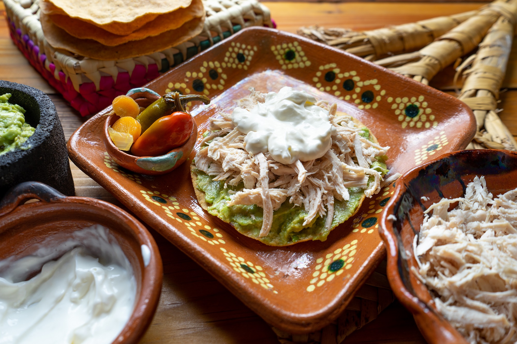 Mexican food. Tortilla toast with chicken and guacamole "tostadas Siberia"